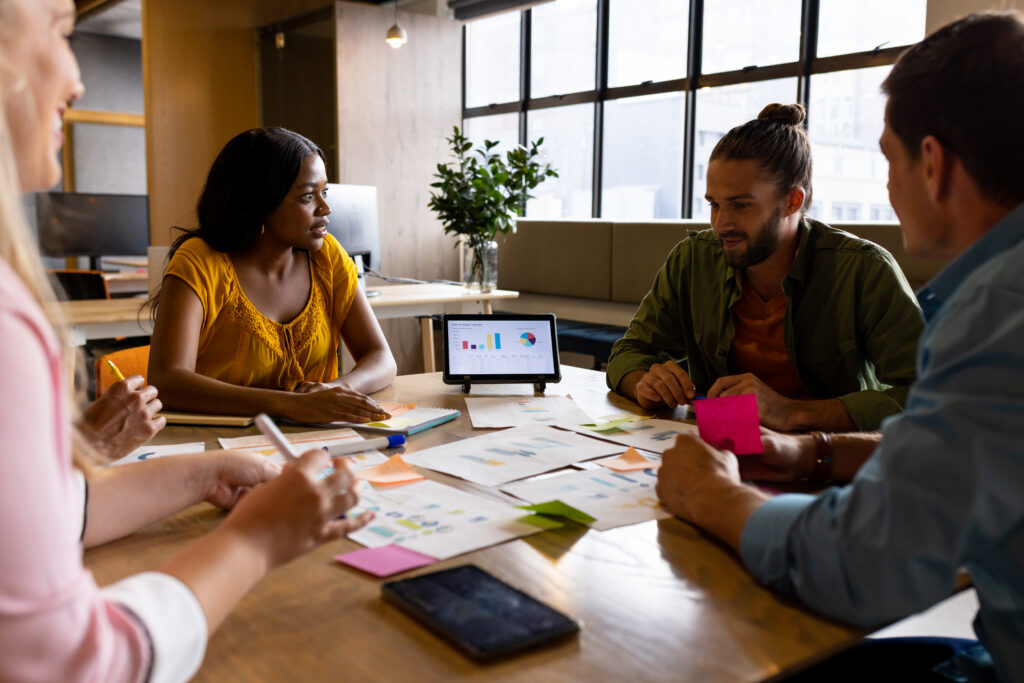 A sales team discussing customer needs in their campaigns.